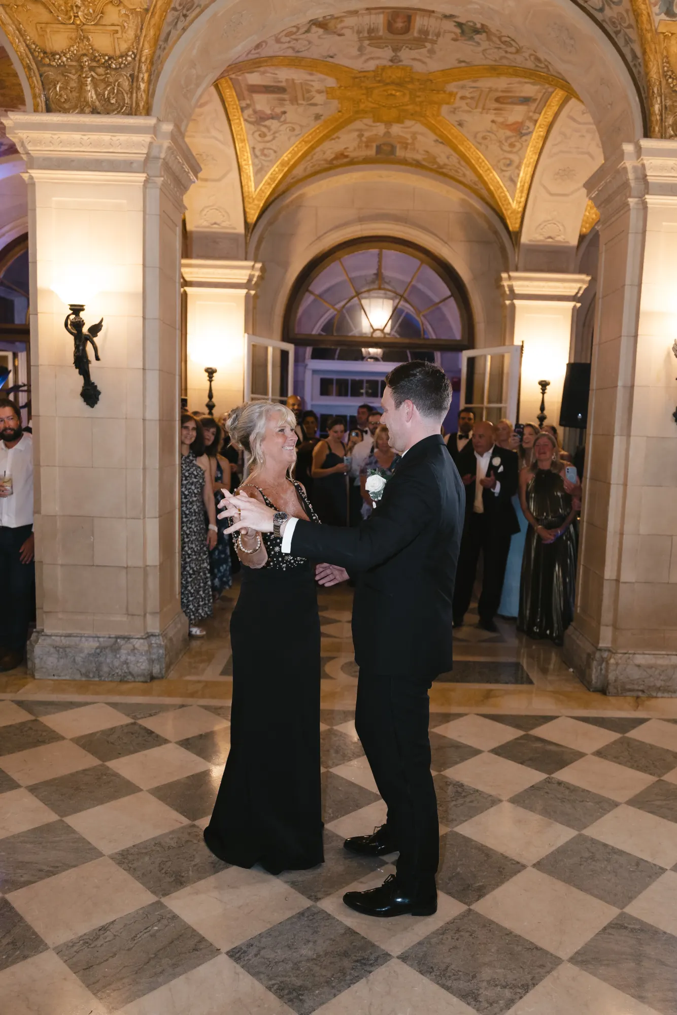 The mother-son dance beneath the gilded arches