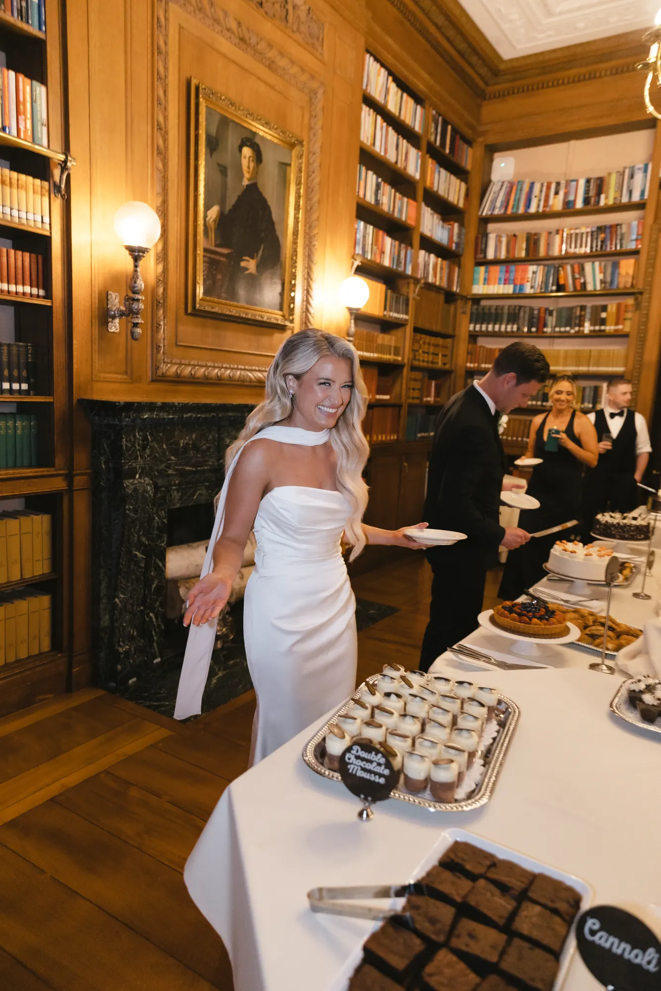 The newlyweds load up plates in the dessert room
