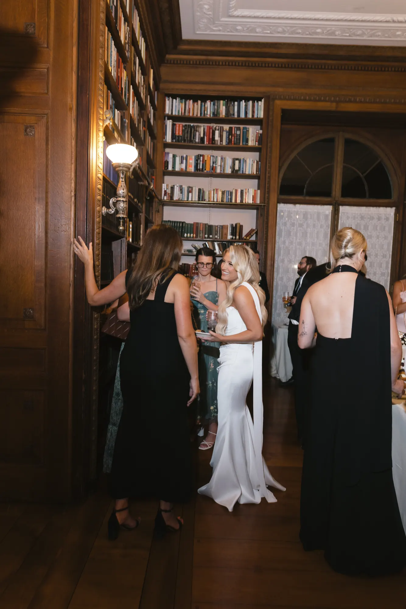 Catching up with guests in the library doorway