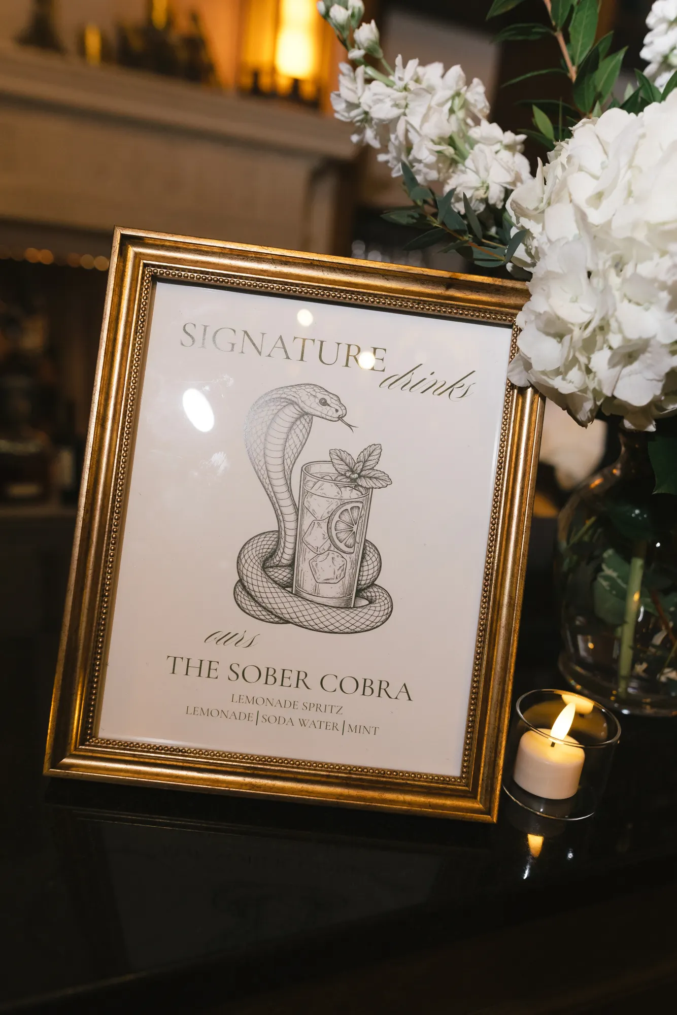The Sober Cobra signature drink sign at the bar