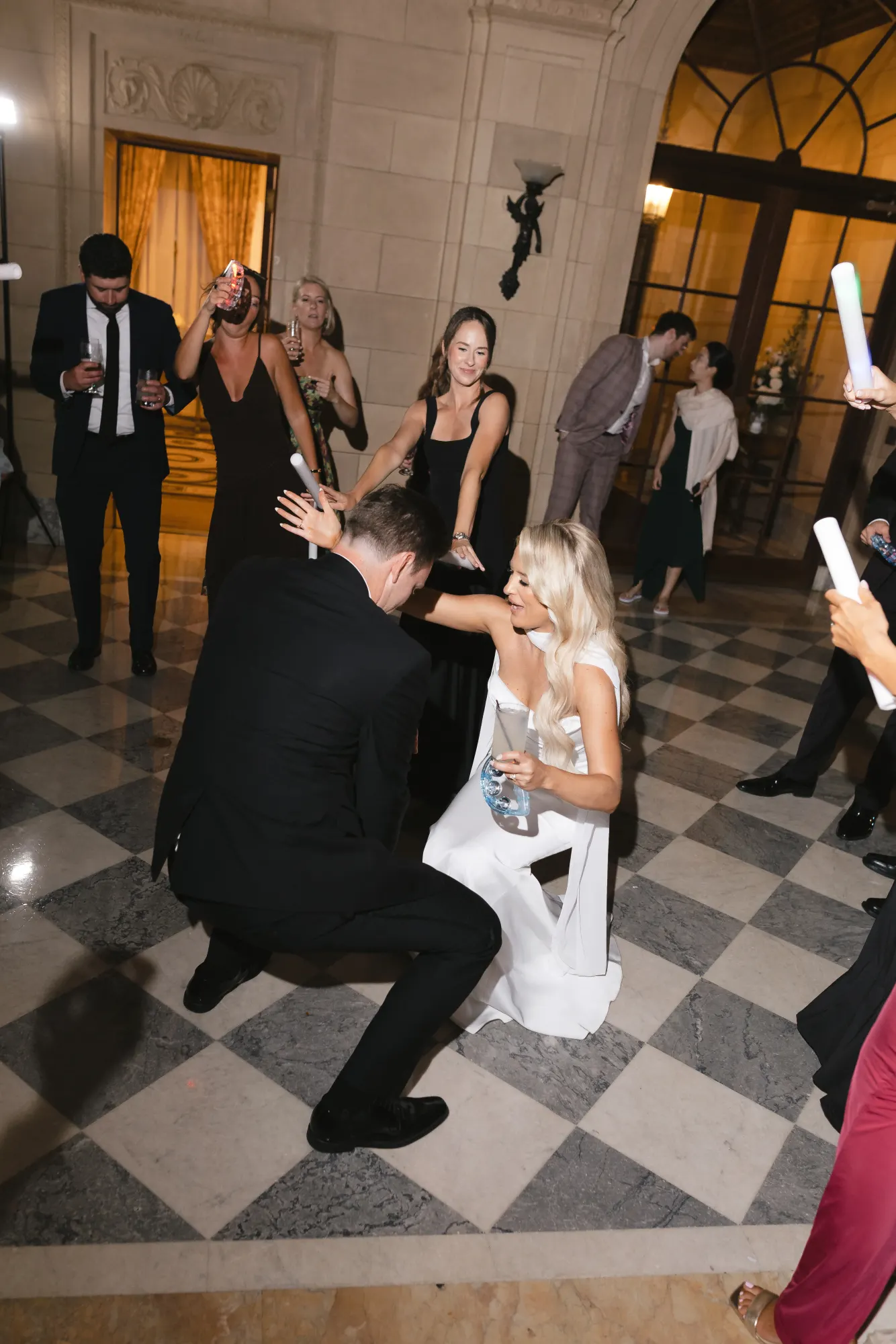 Colleen and Max get low on the checkerboard floor