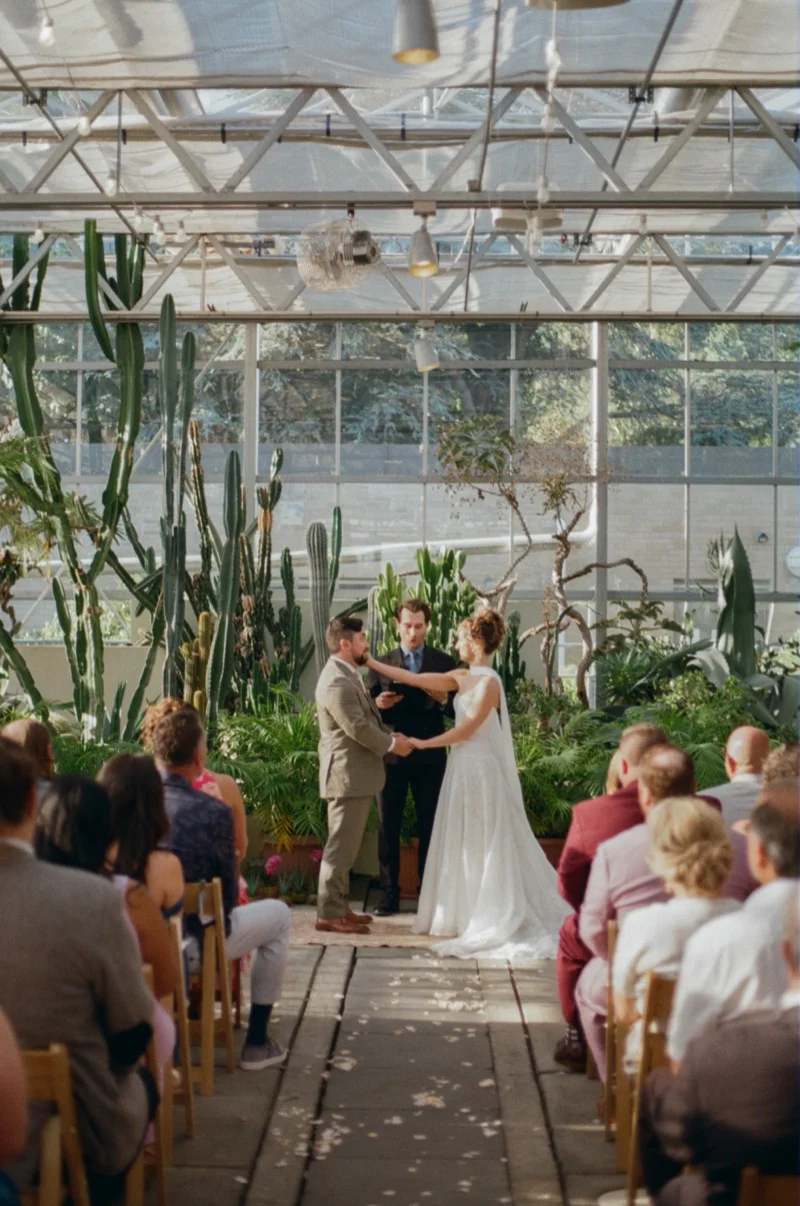 Emotional ceremony moment at Gabi and Ike botanical garden wedding