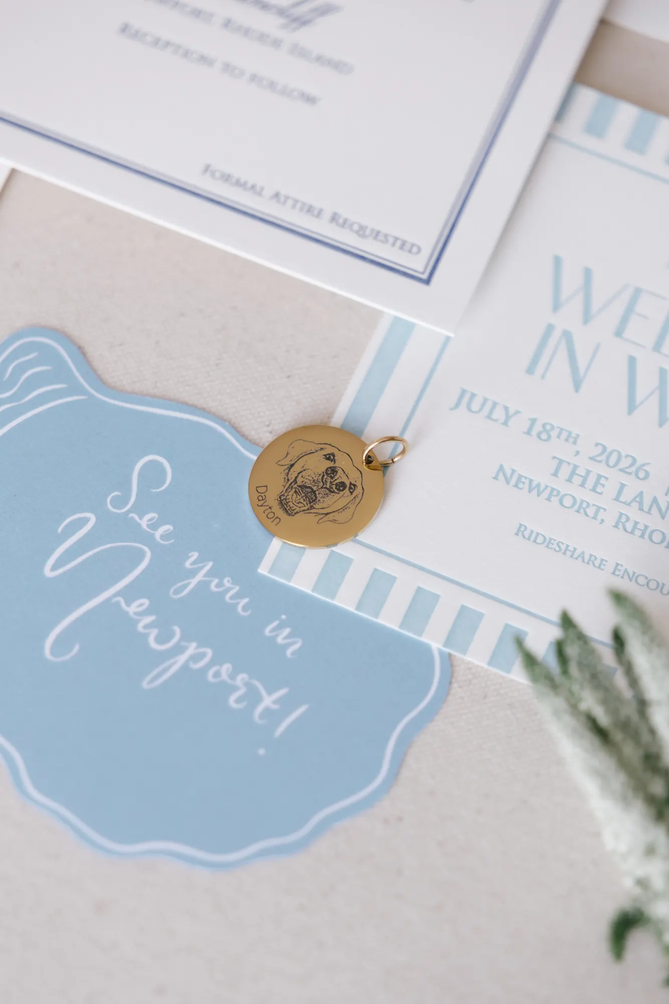 See You in Newport welcome card with a gold wax seal from the stationery suite