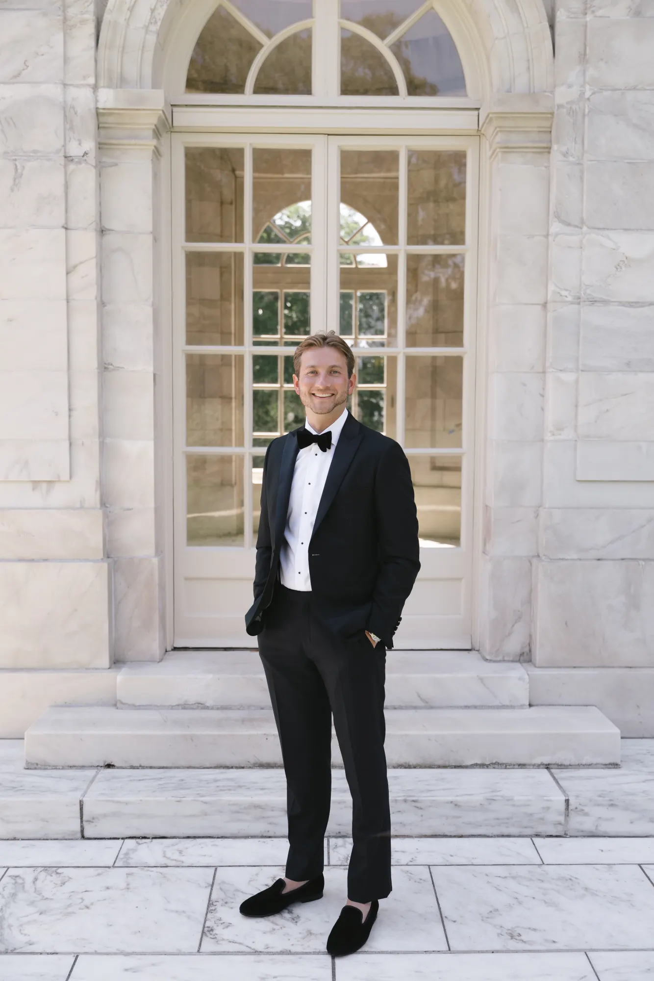 Groom portrait at the marble garden pavilion of The Elms in Newport