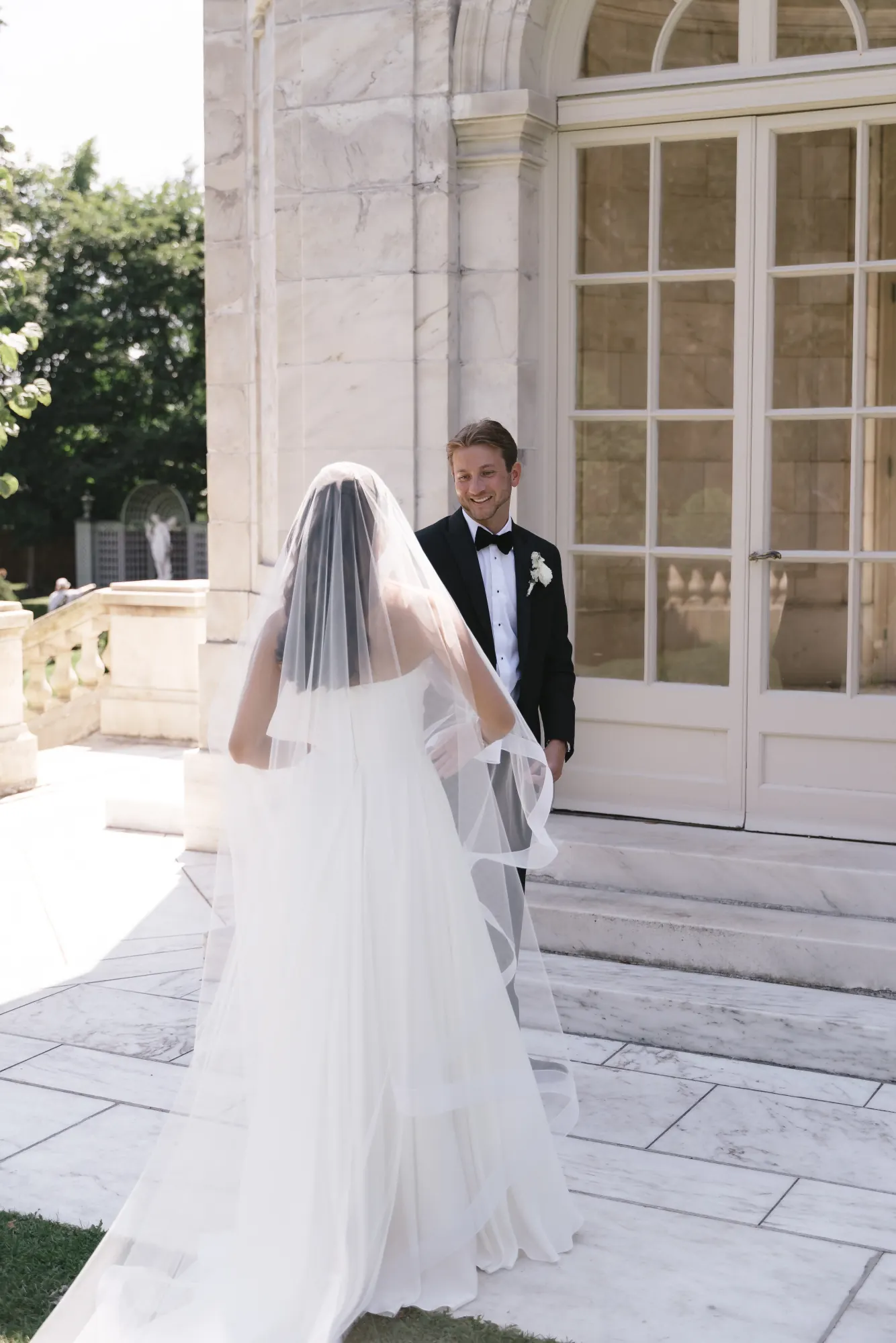 The groom turns for the first look at The Elms in Newport