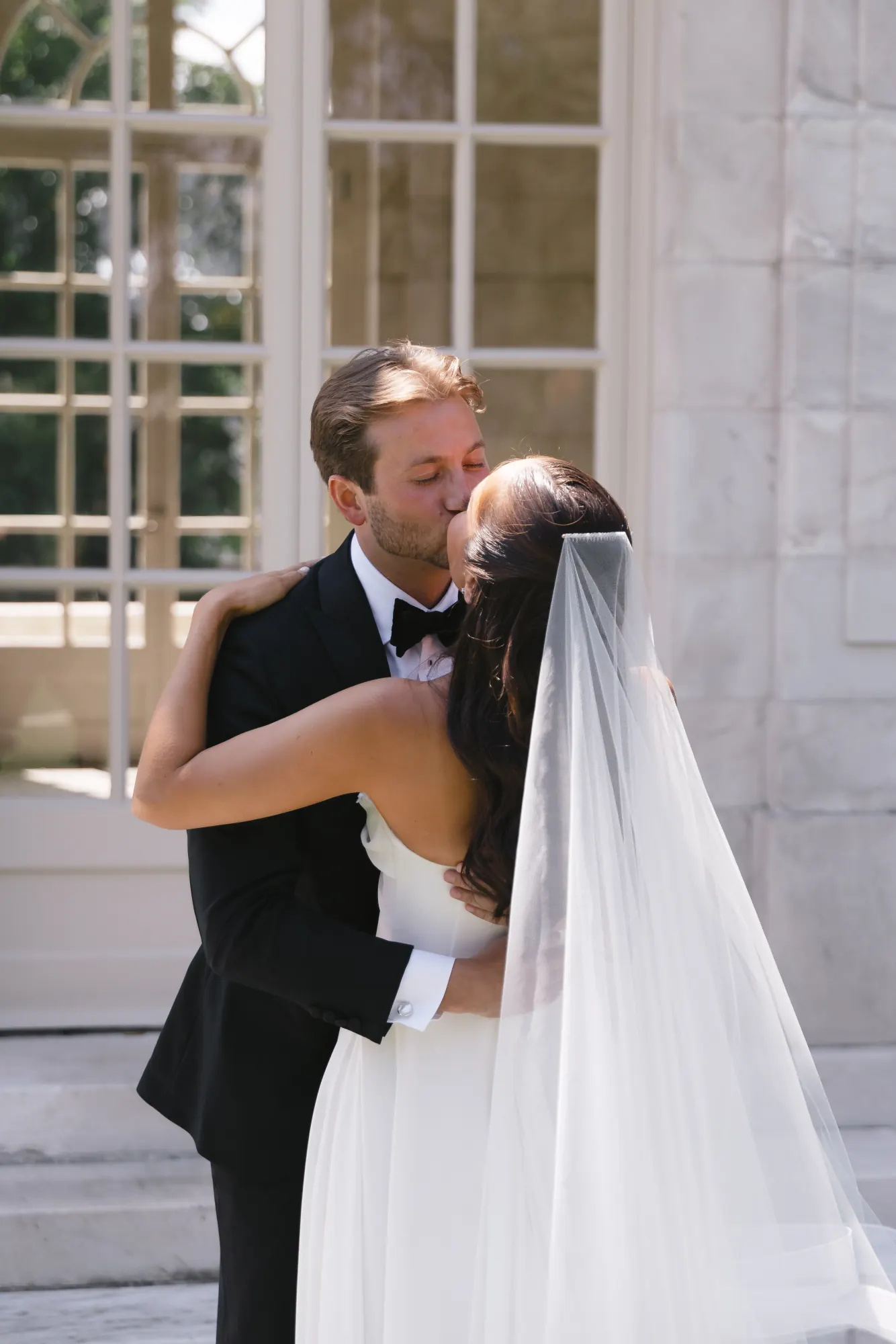 First look kiss at The Elms garden pavilion