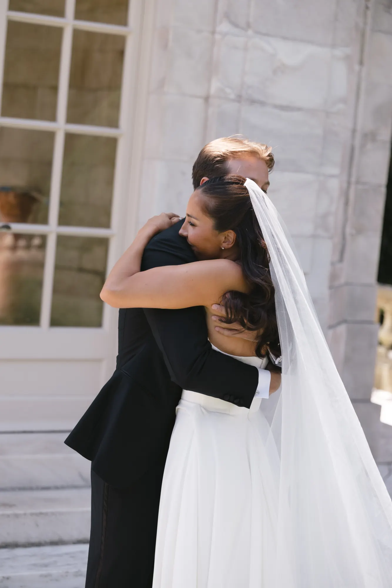 Bride and groom embrace after their first look at The Elms