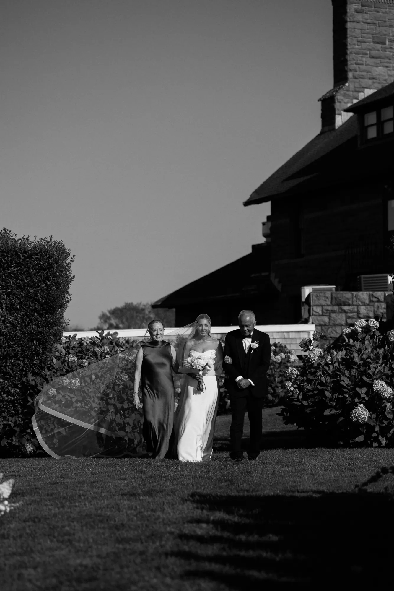 Black and white of the bride's processional at OceanCliff