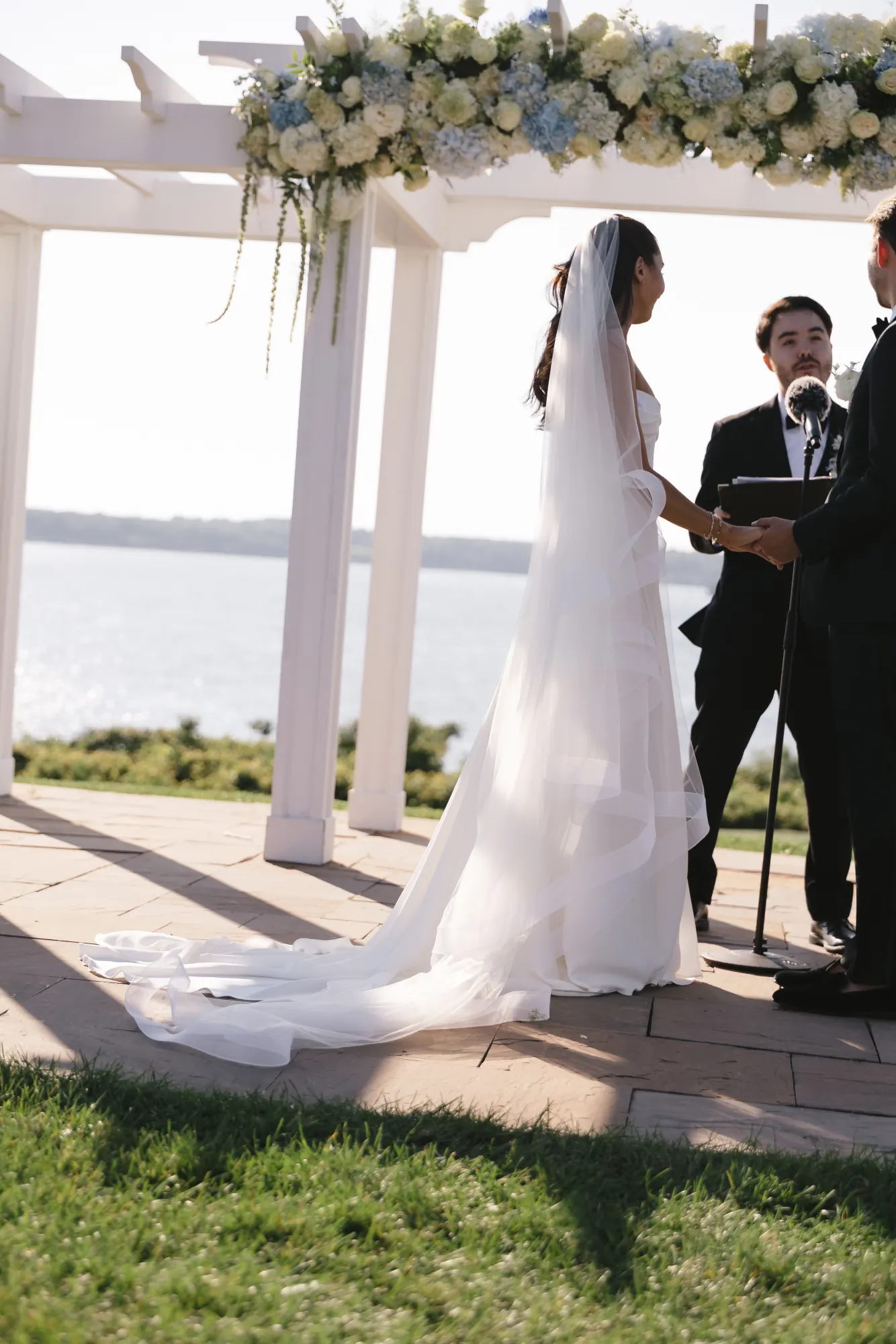 Vows under the flower-topped pergola at OceanCliff in Newport