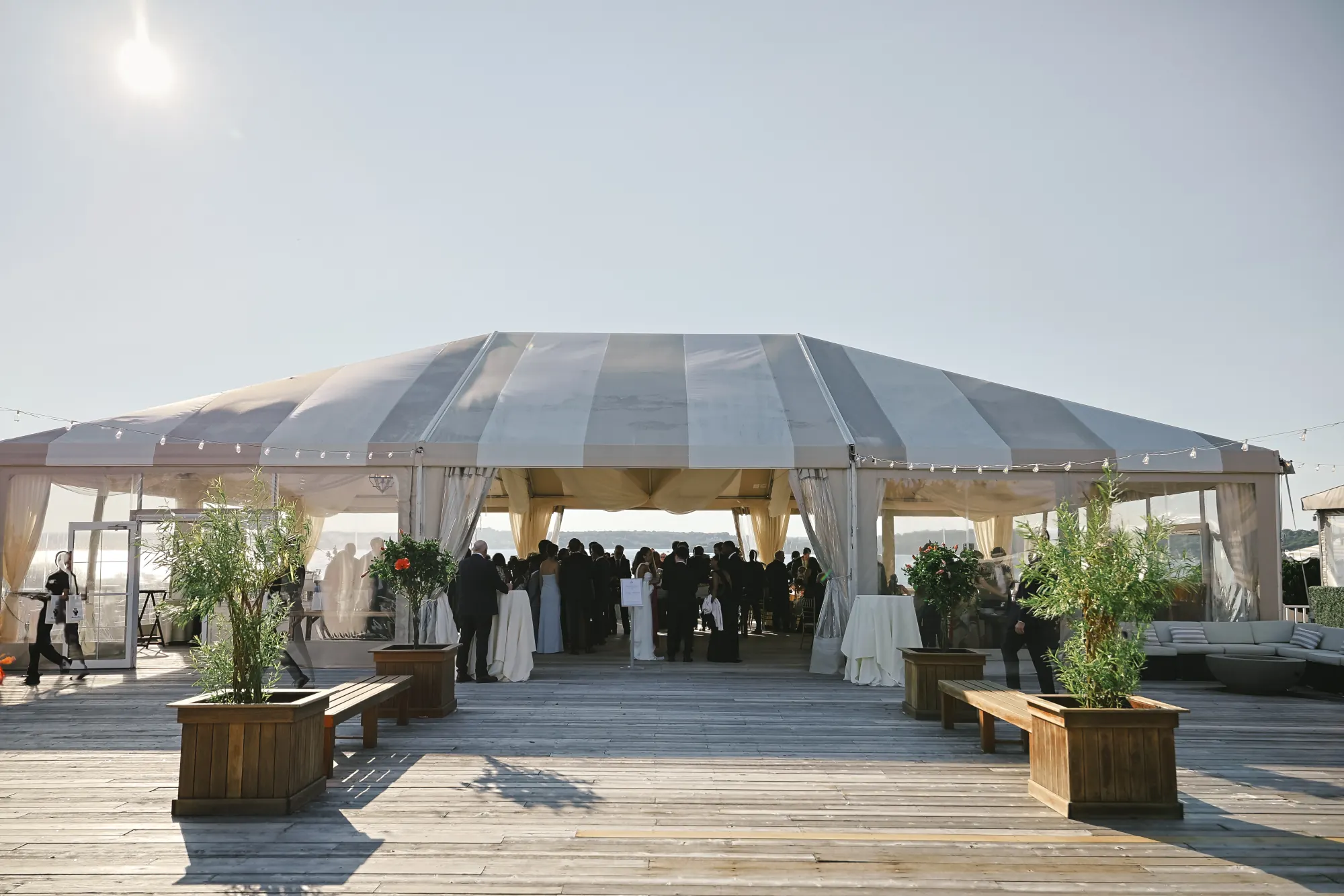The tented Upper Deck set for cocktail hour at OceanCliff