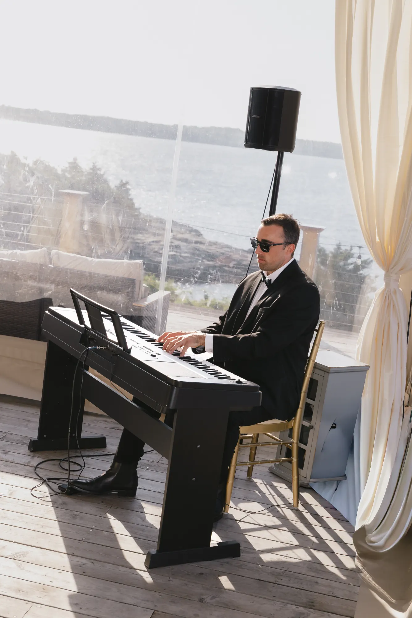 Live keys during cocktail hour on the Upper Deck overlooking the bay