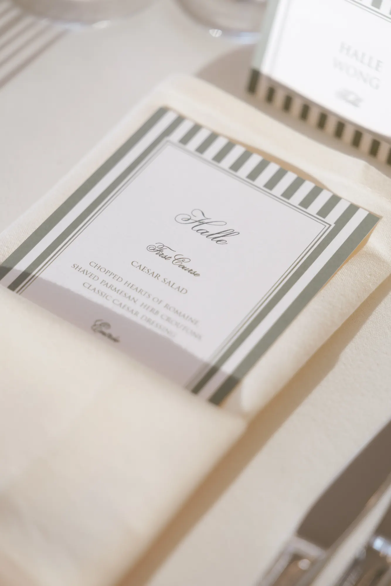 Striped place card and menu detail at the reception