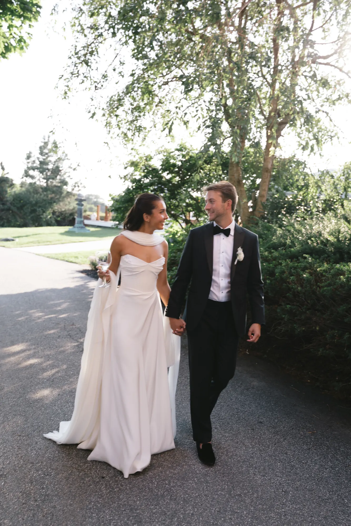 Newlyweds walk the OceanCliff grounds hand in hand