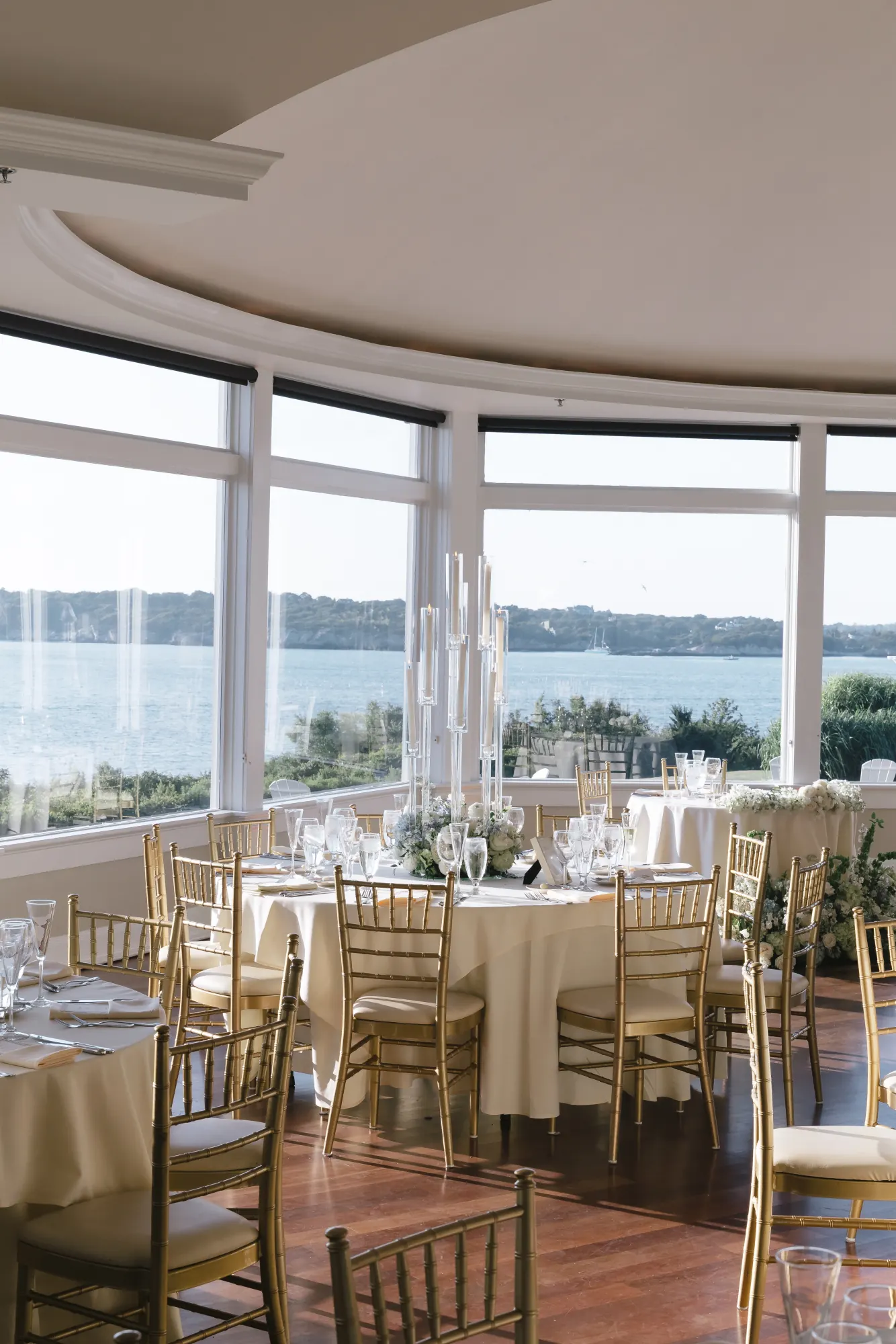 Reception tables along the curved bay windows at OceanCliff