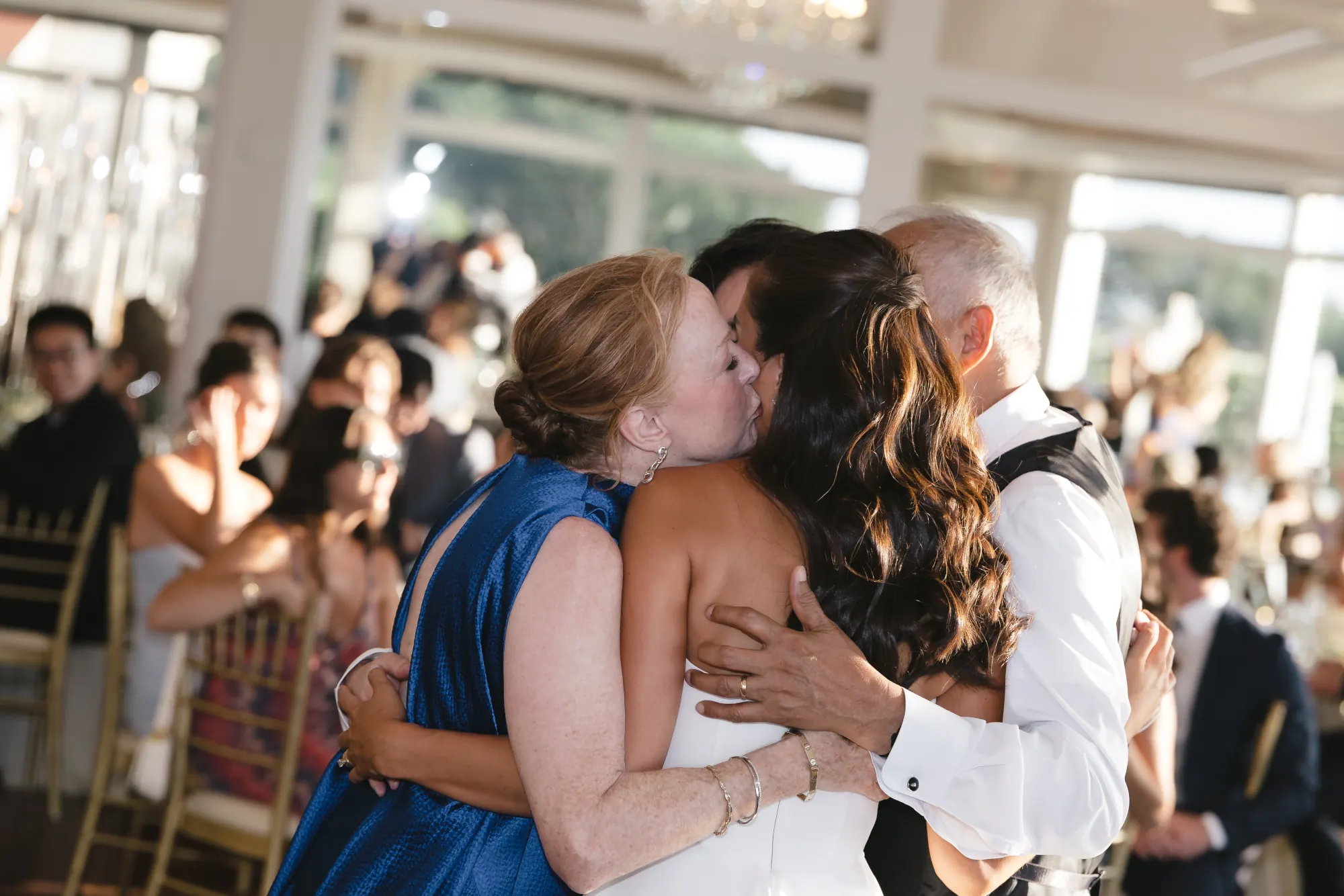 A kiss on the cheek during the parent dances