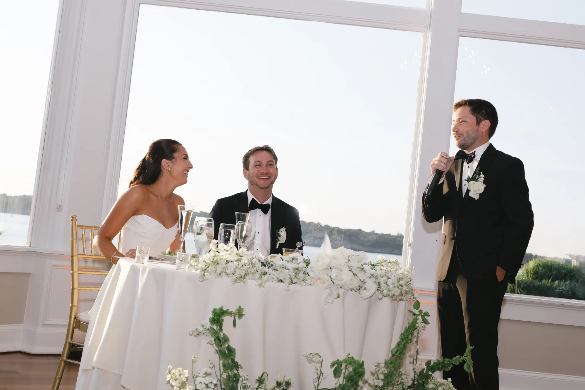 The best man raises a toast at the sweetheart table