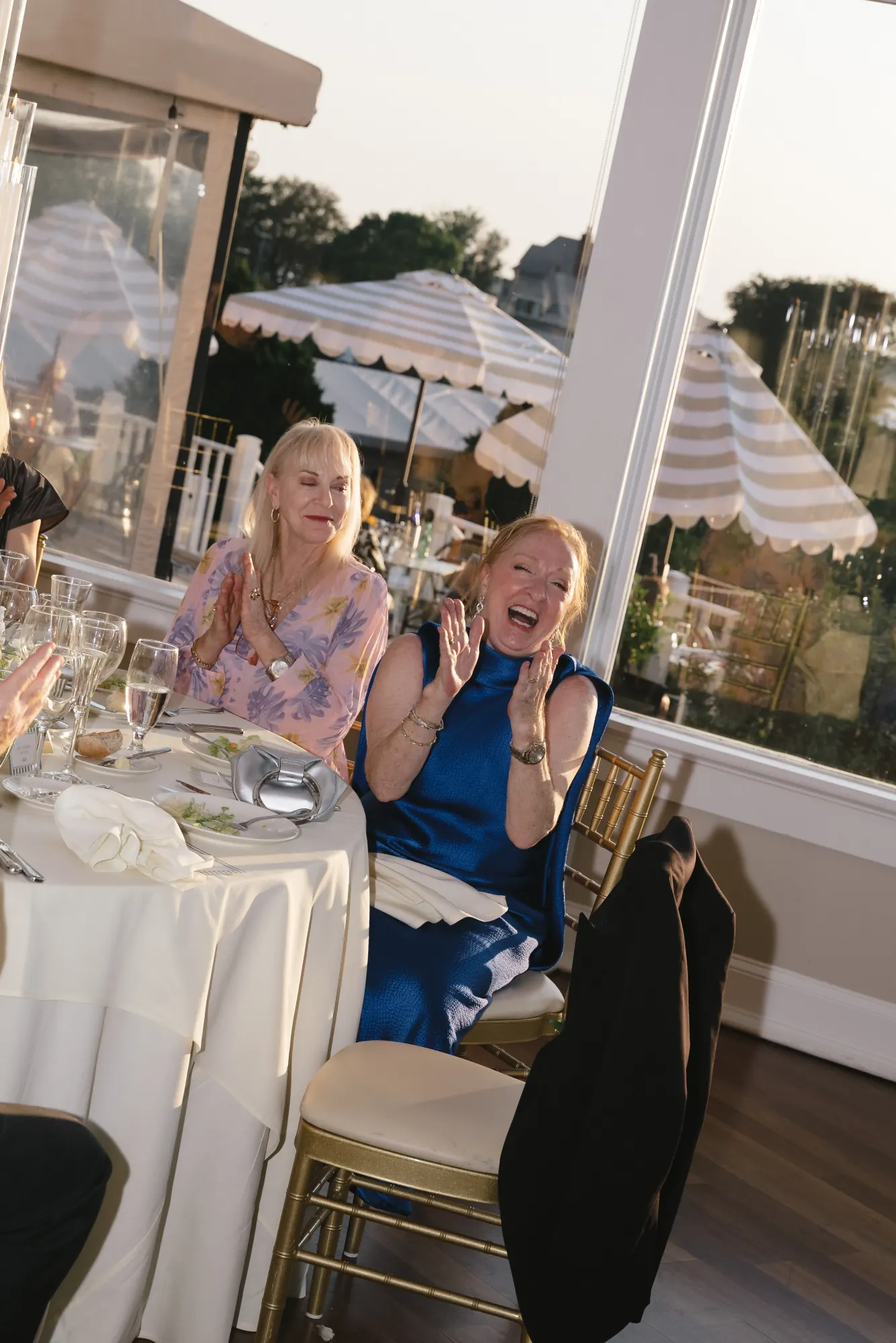 Guests laugh along during the reception toasts