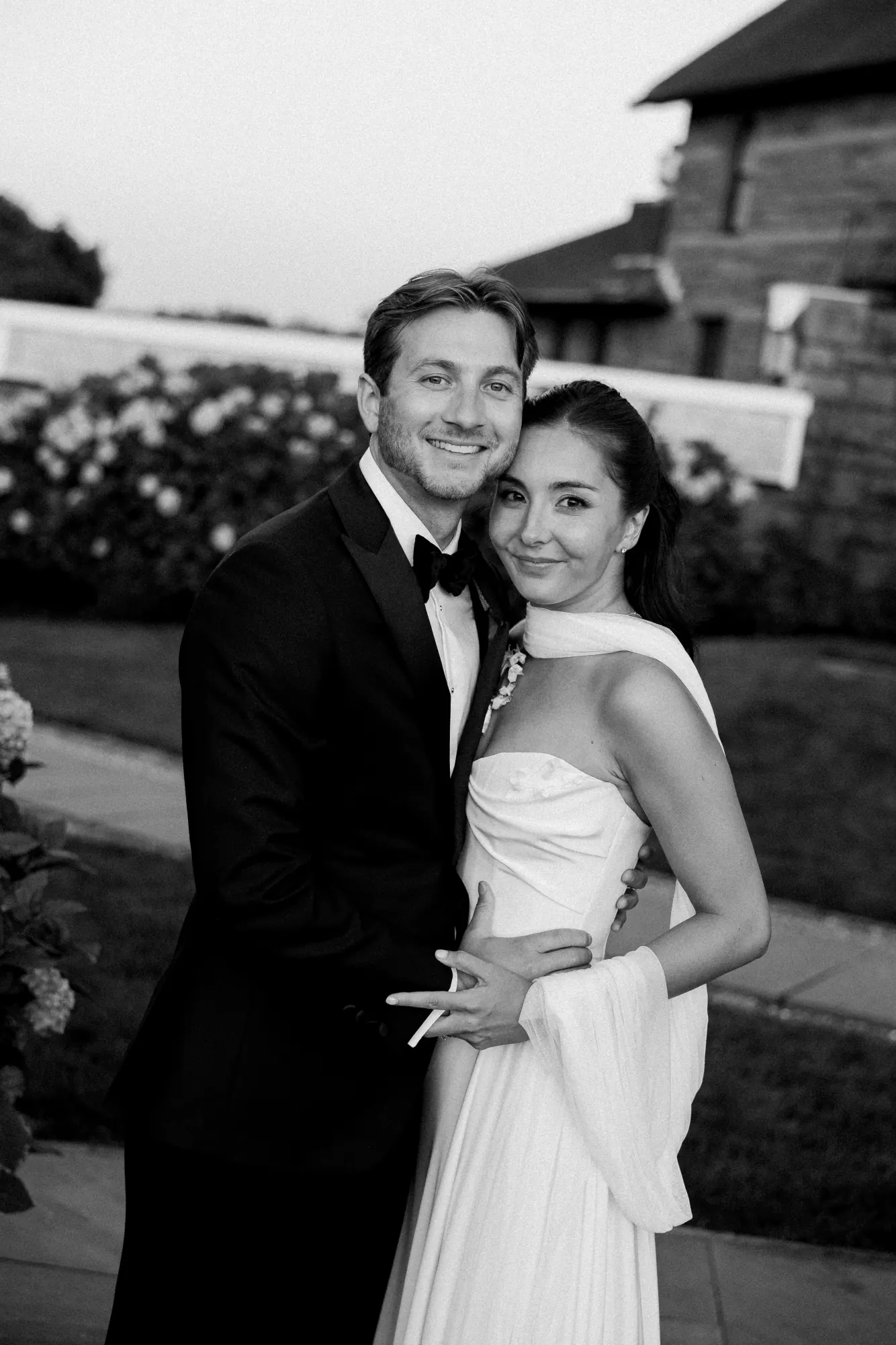 Black and white golden hour portrait of the newlyweds
