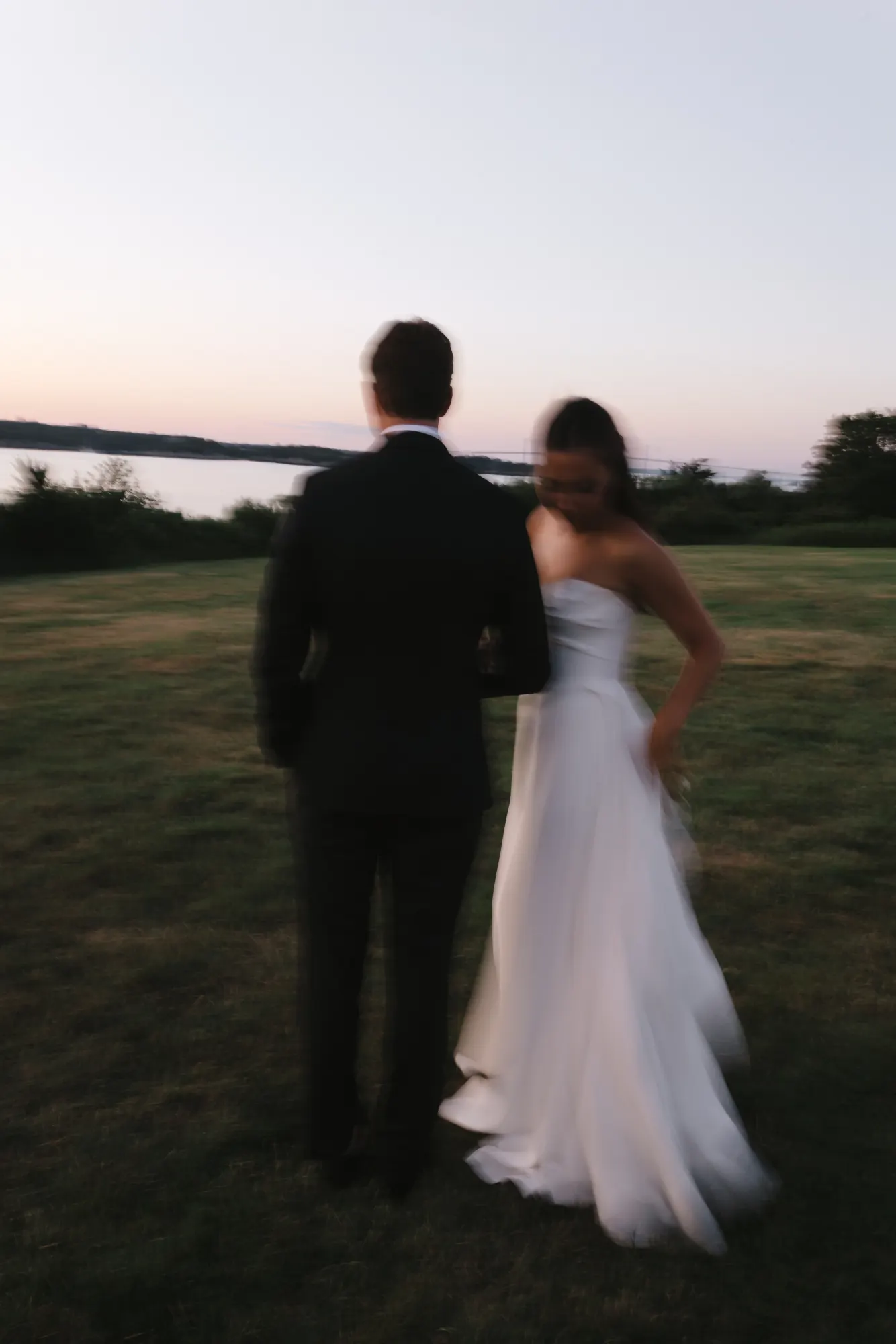 The couple alone on the lawn at blue hour