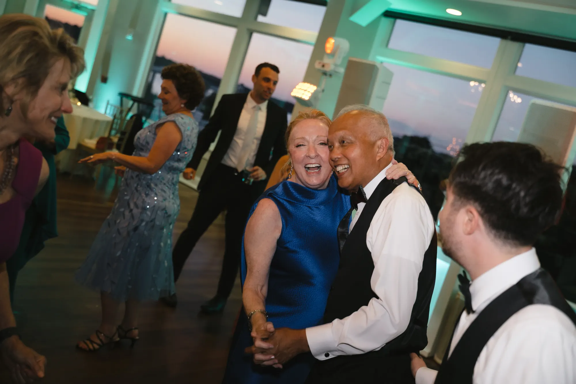 Guests fill the dance floor at the OceanCliff reception