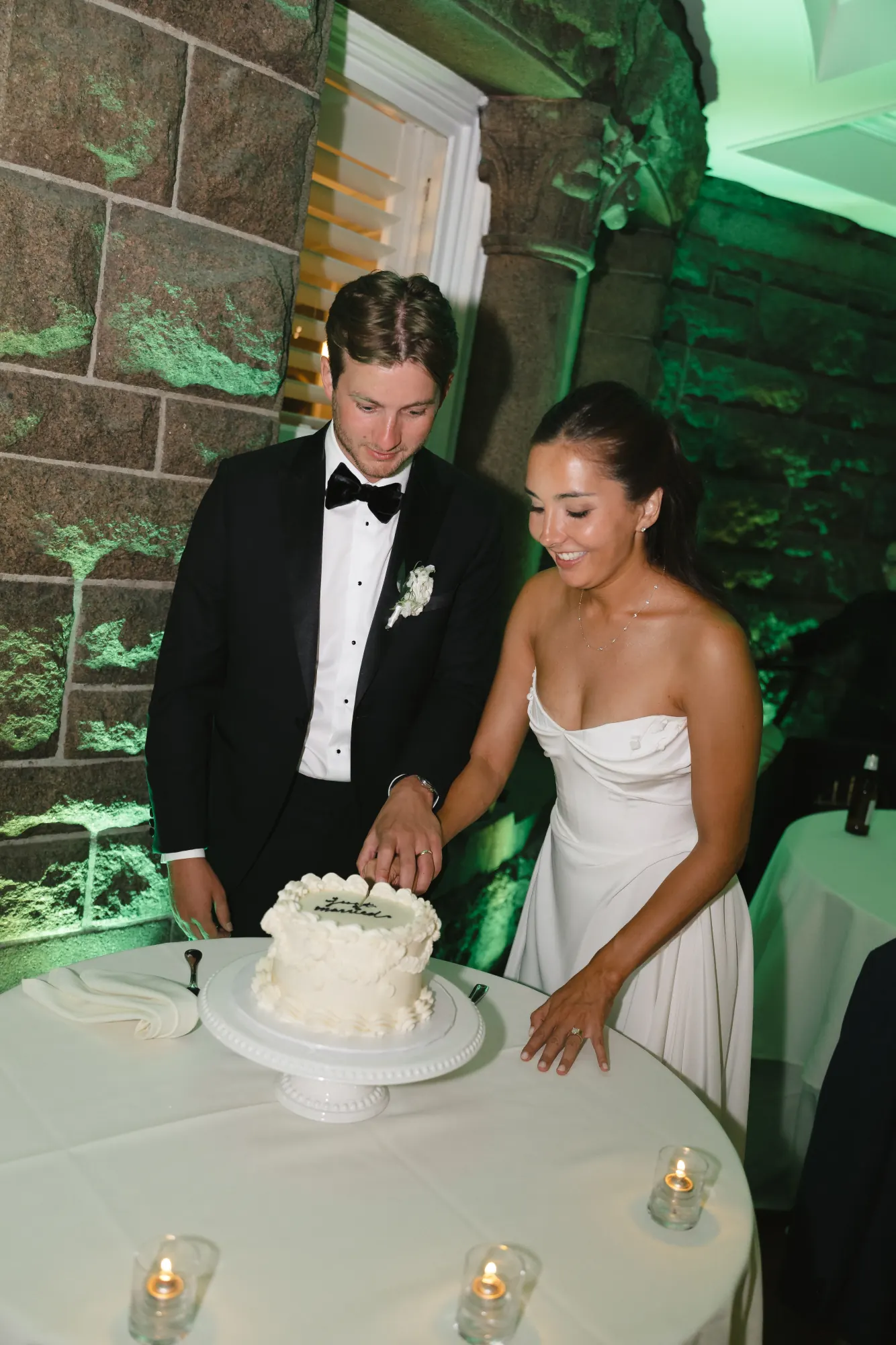 Cake cutting on the terrace outside the stone mansion