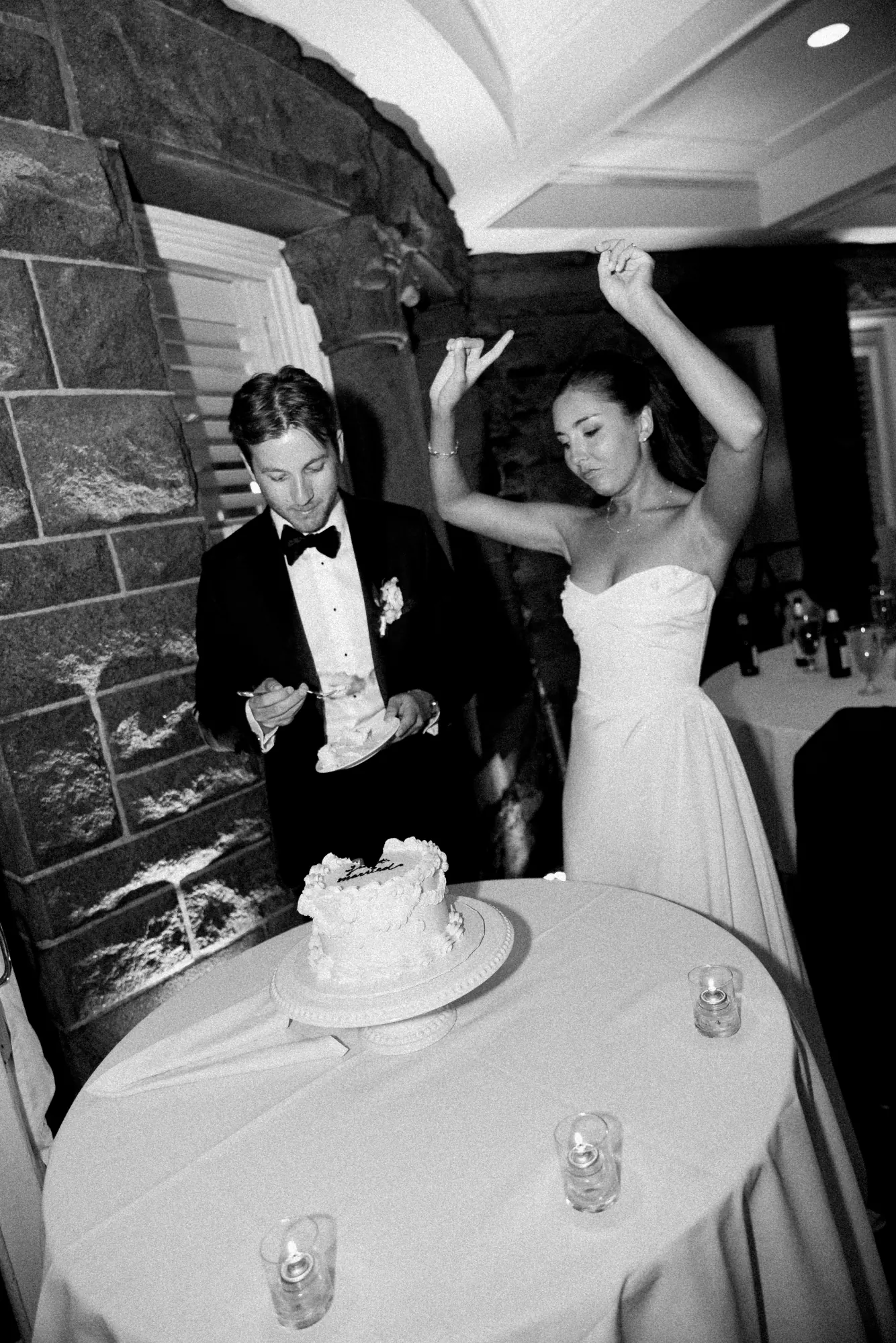 The bride dances beside the cake table