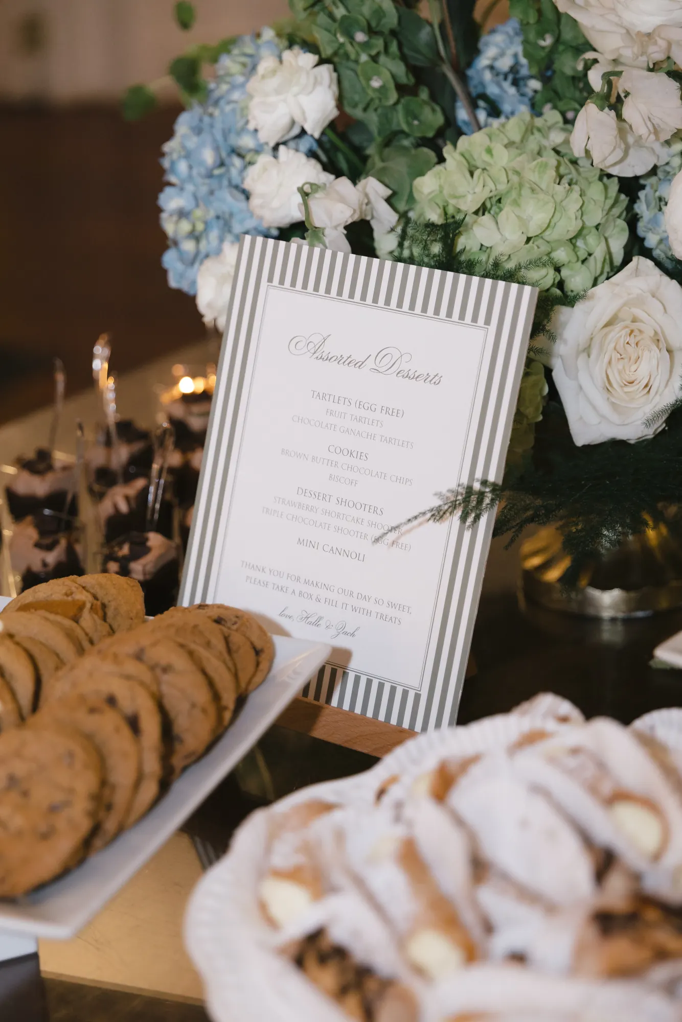 Dessert display of cookies and sweets by Bella Confections