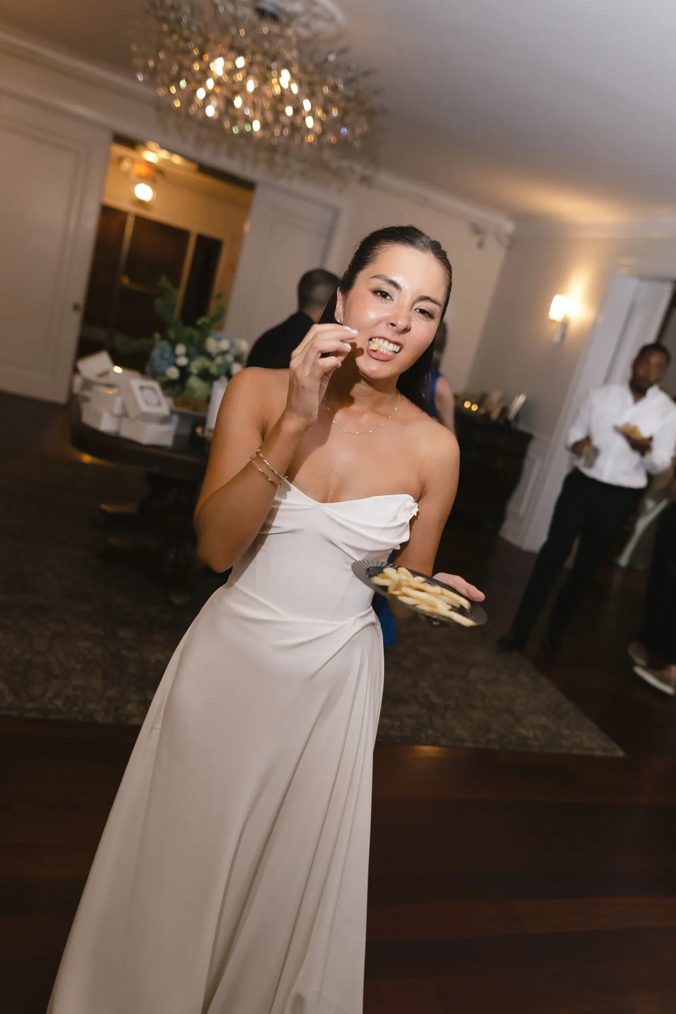 The bride enjoys a dessert mid-dance floor