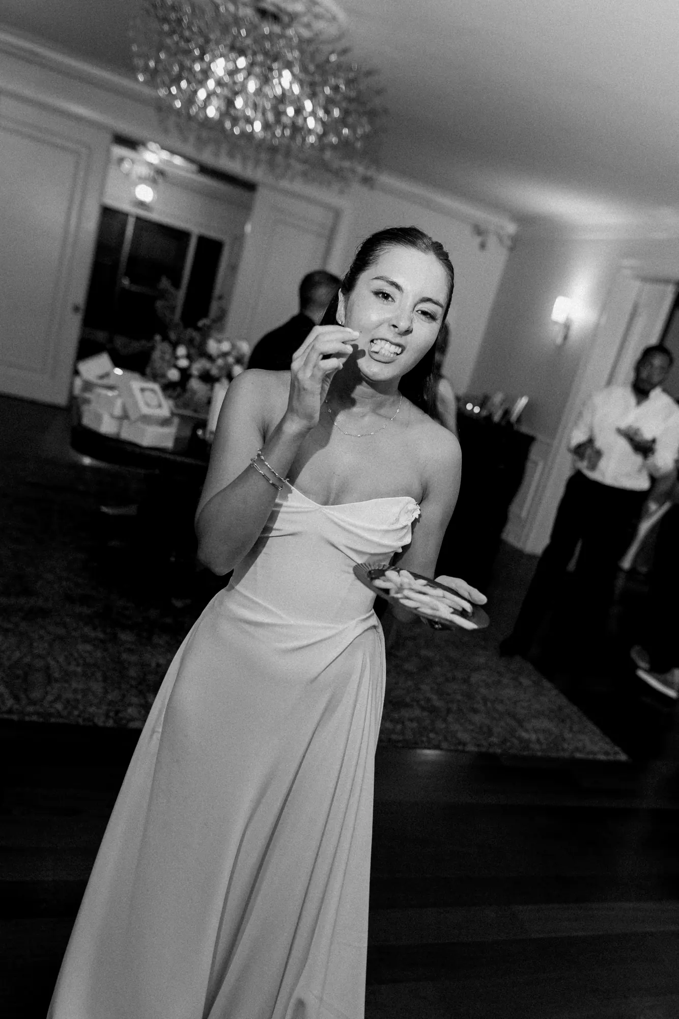 Black and white of the bride laughing on the dance floor