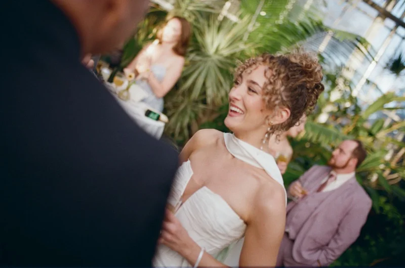 Bride laughing at cocktail hour