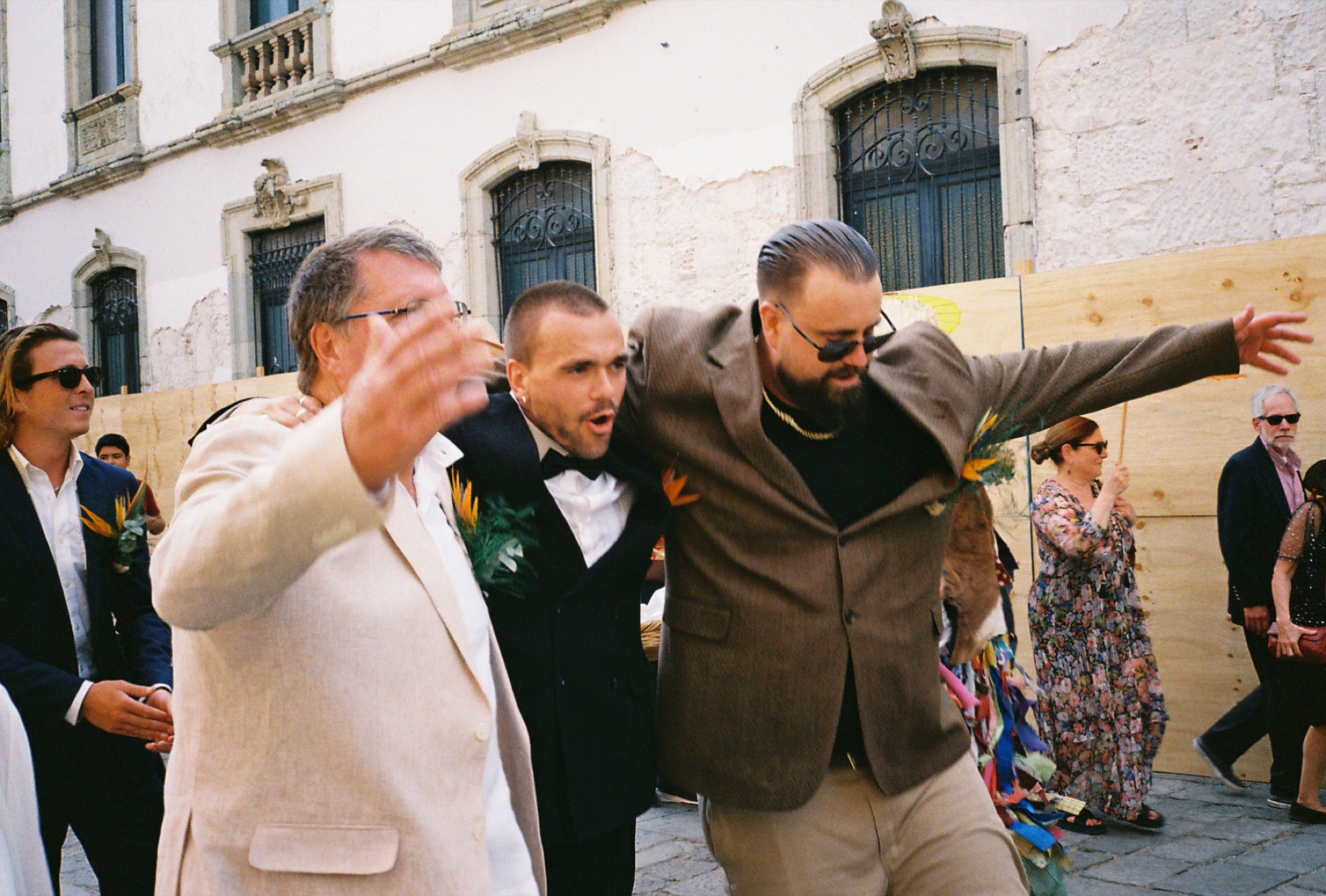 Groomsmen celebrating on film