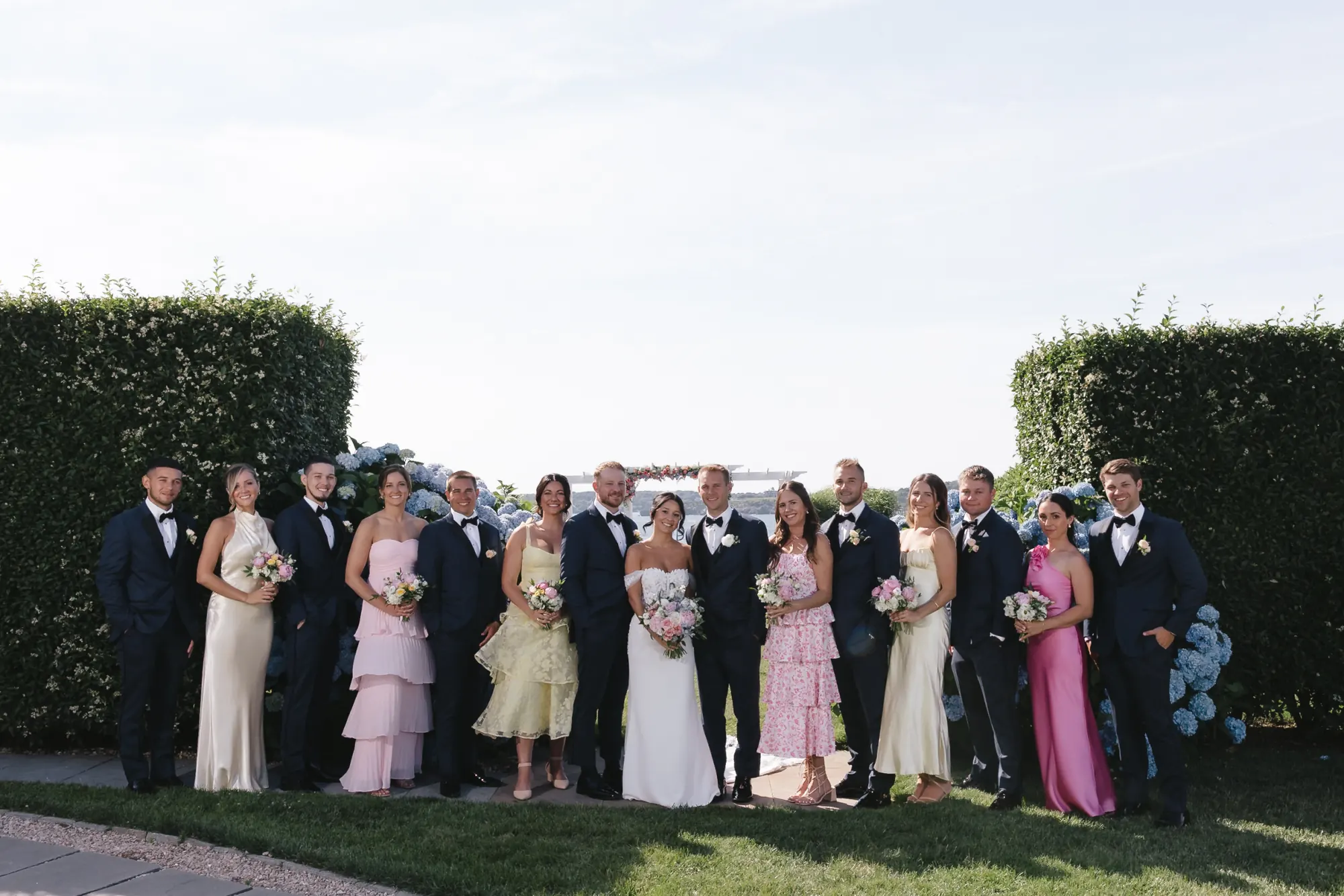 The full wedding party on the lawn at OceanCliff in Newport, Rhode Island