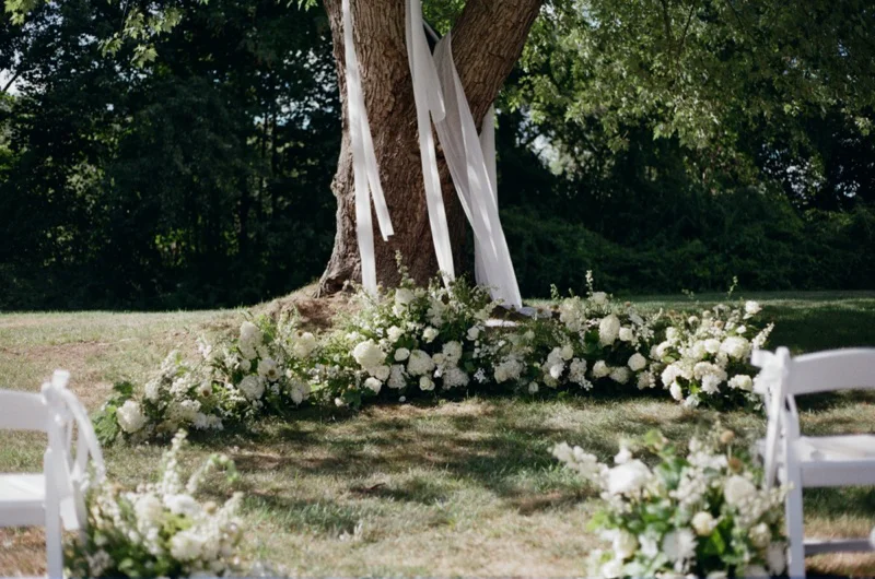 Ceremony aisle lined with hydrangeas at Floriana